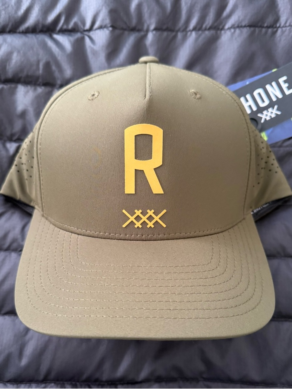 RHONE ⛳️ olive green & reflective yellow performance hat